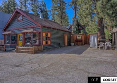 Affordable Getaway Big Bear Mountain Cabin Airbnb 8 person exterior lot view with natural woodworking
