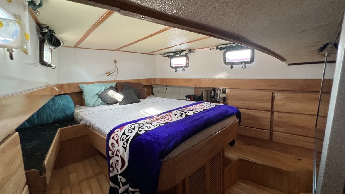 Seas Lyfe master stateroom with teak woodwork